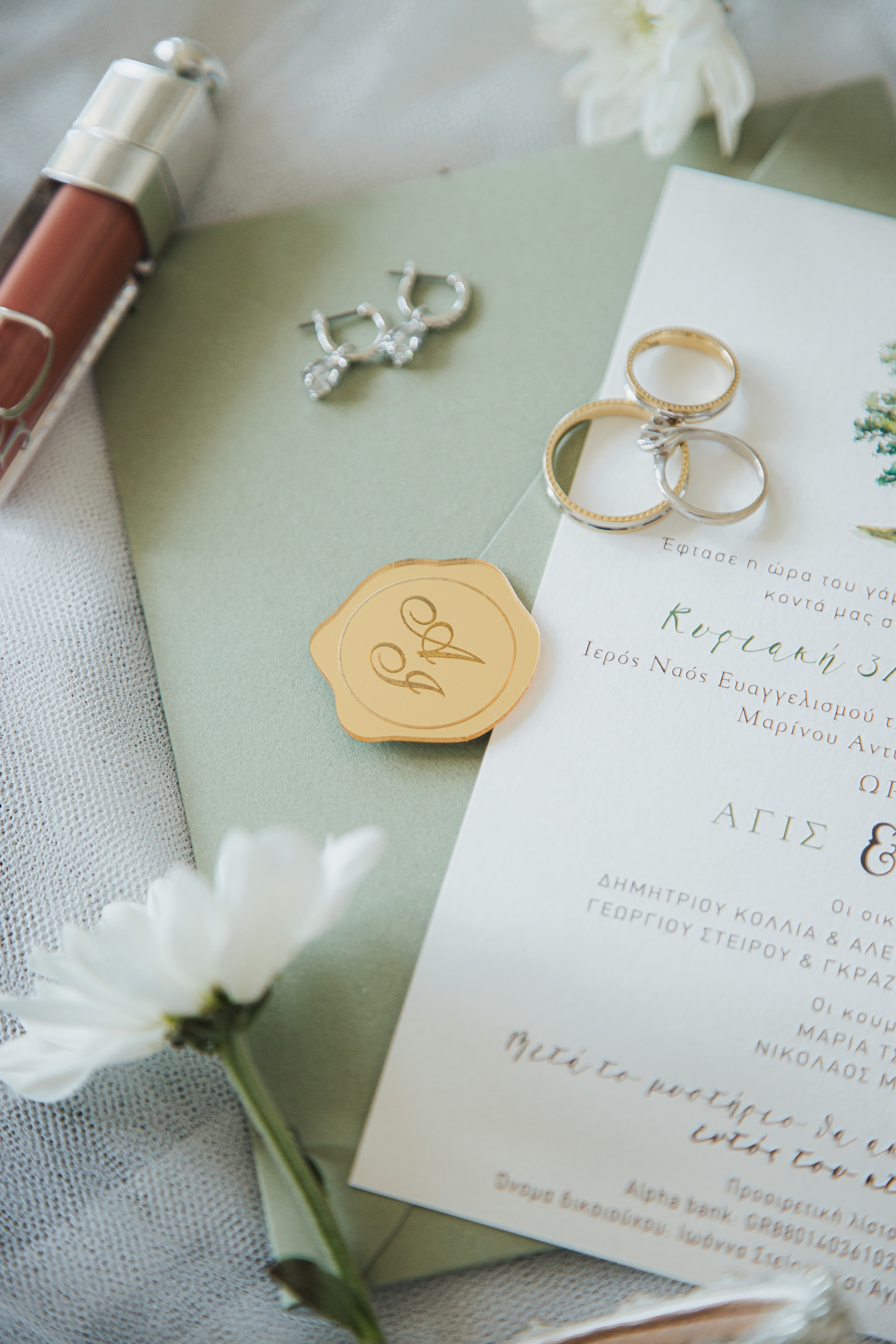 Wedding rings and stationery detail