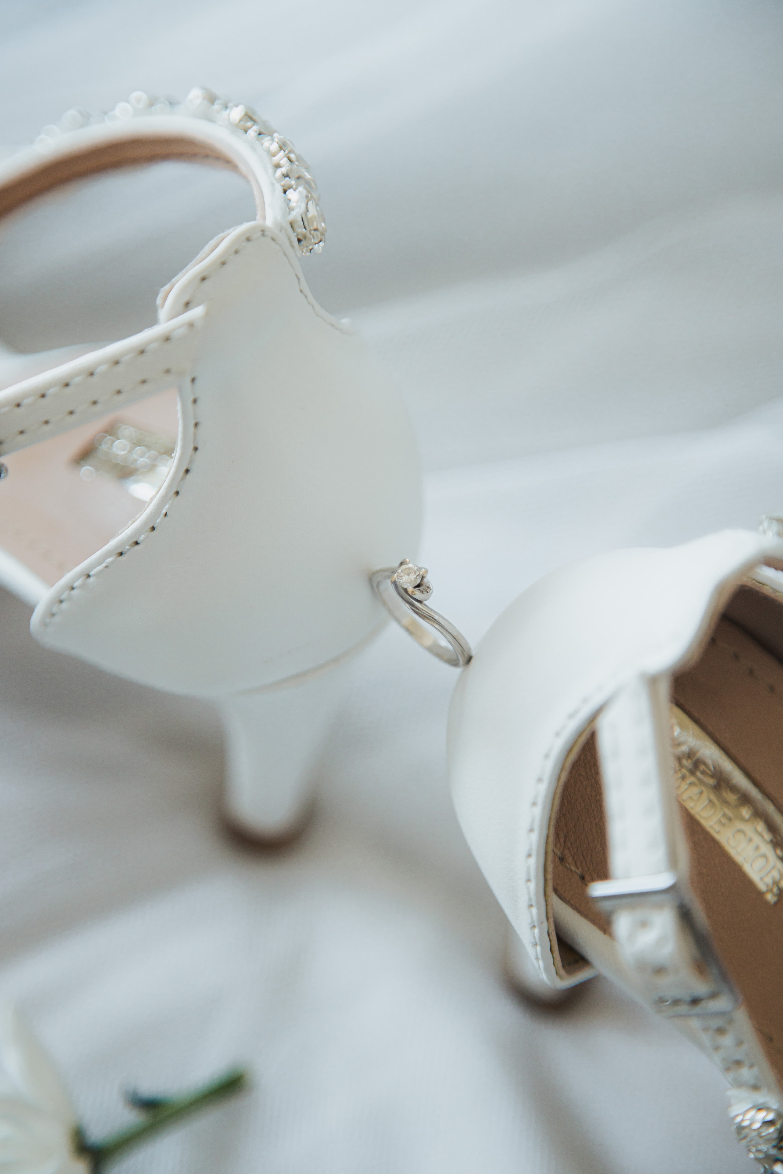 Bridal shoes and engagement ring detail