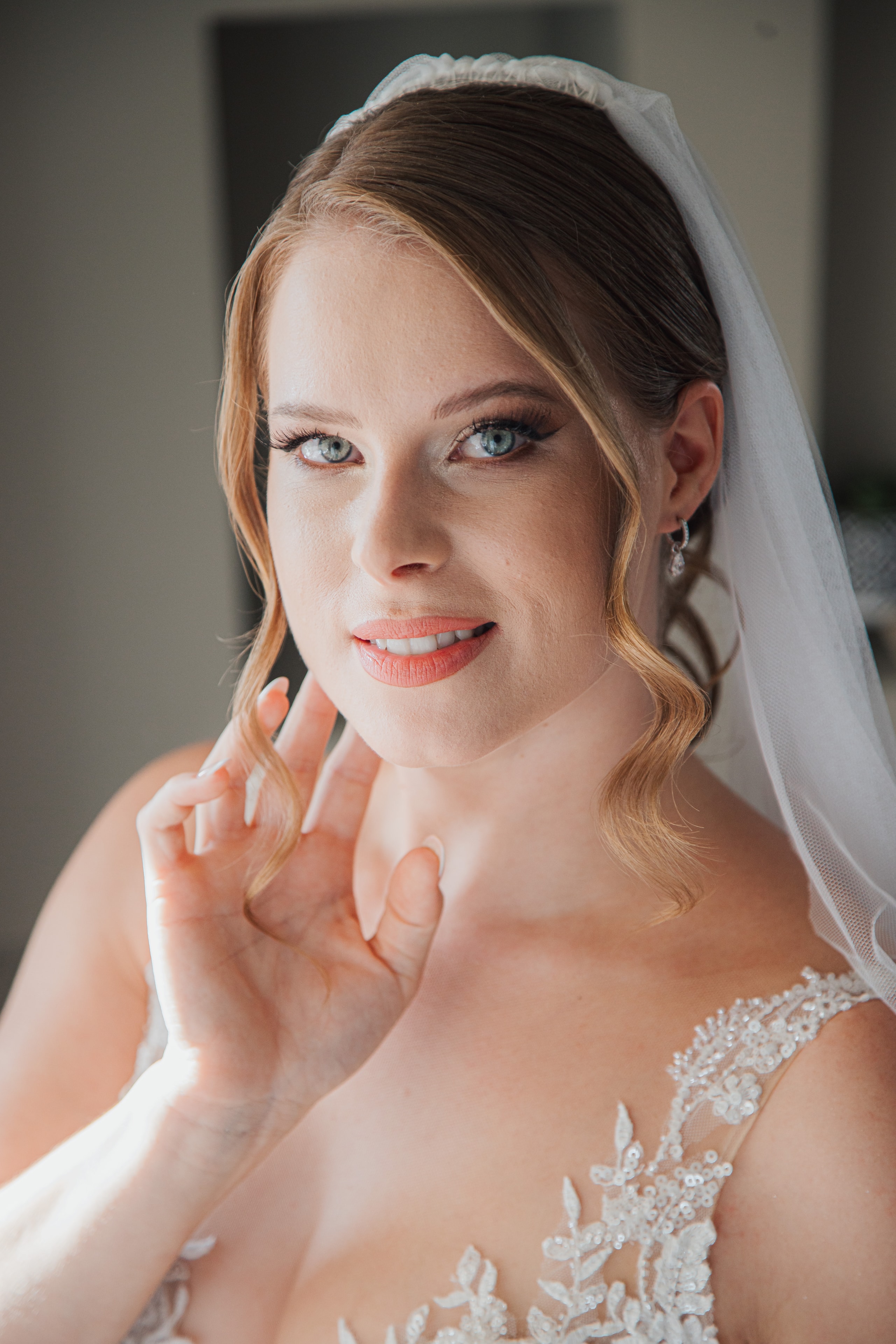 Ioanna in a close bridal portrait with her veil