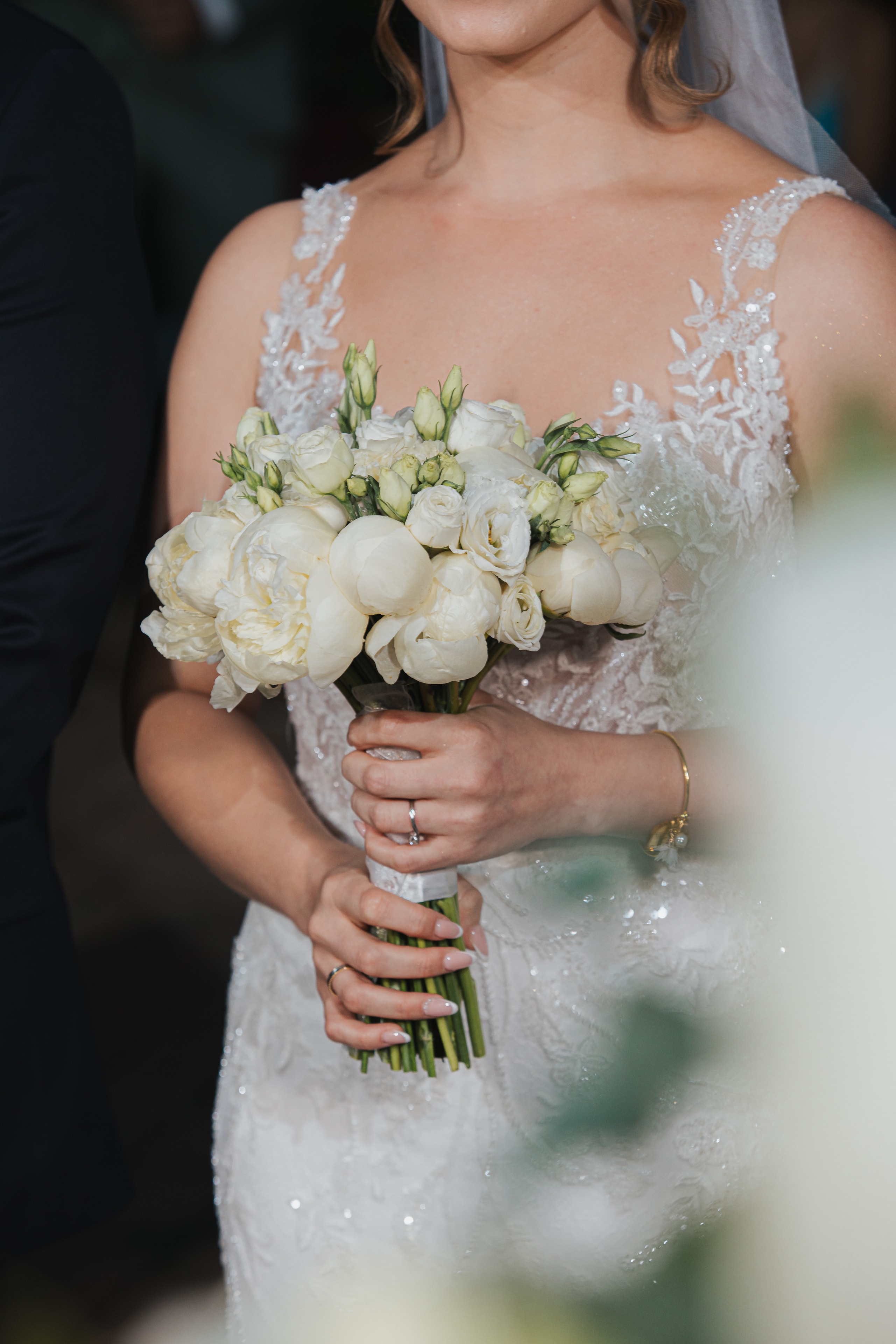 Ioanna holding her white wedding bouquet