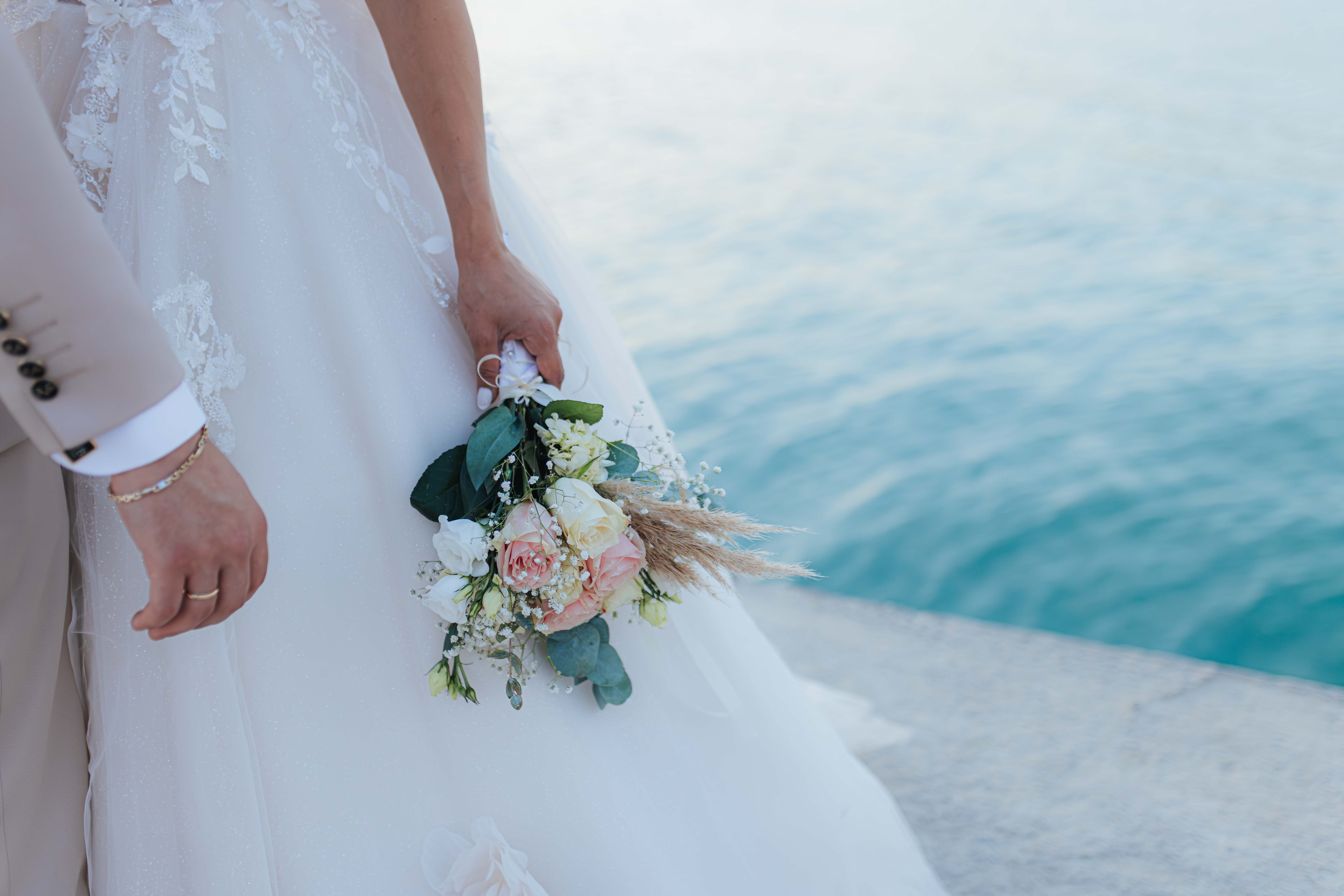 Mihalis and Varvara beside the turquoise sea