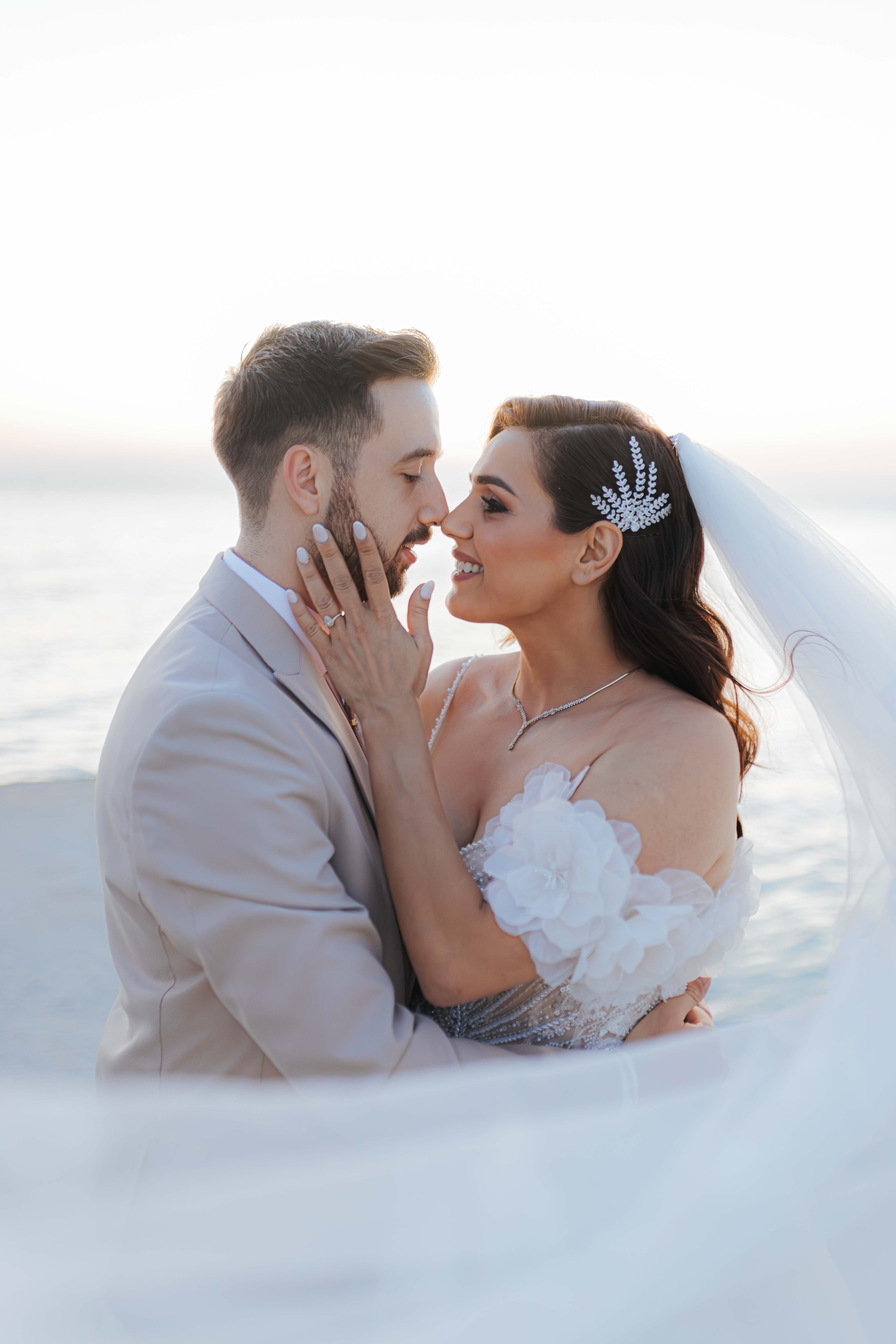 Mihalis and Varvara embracing by the water