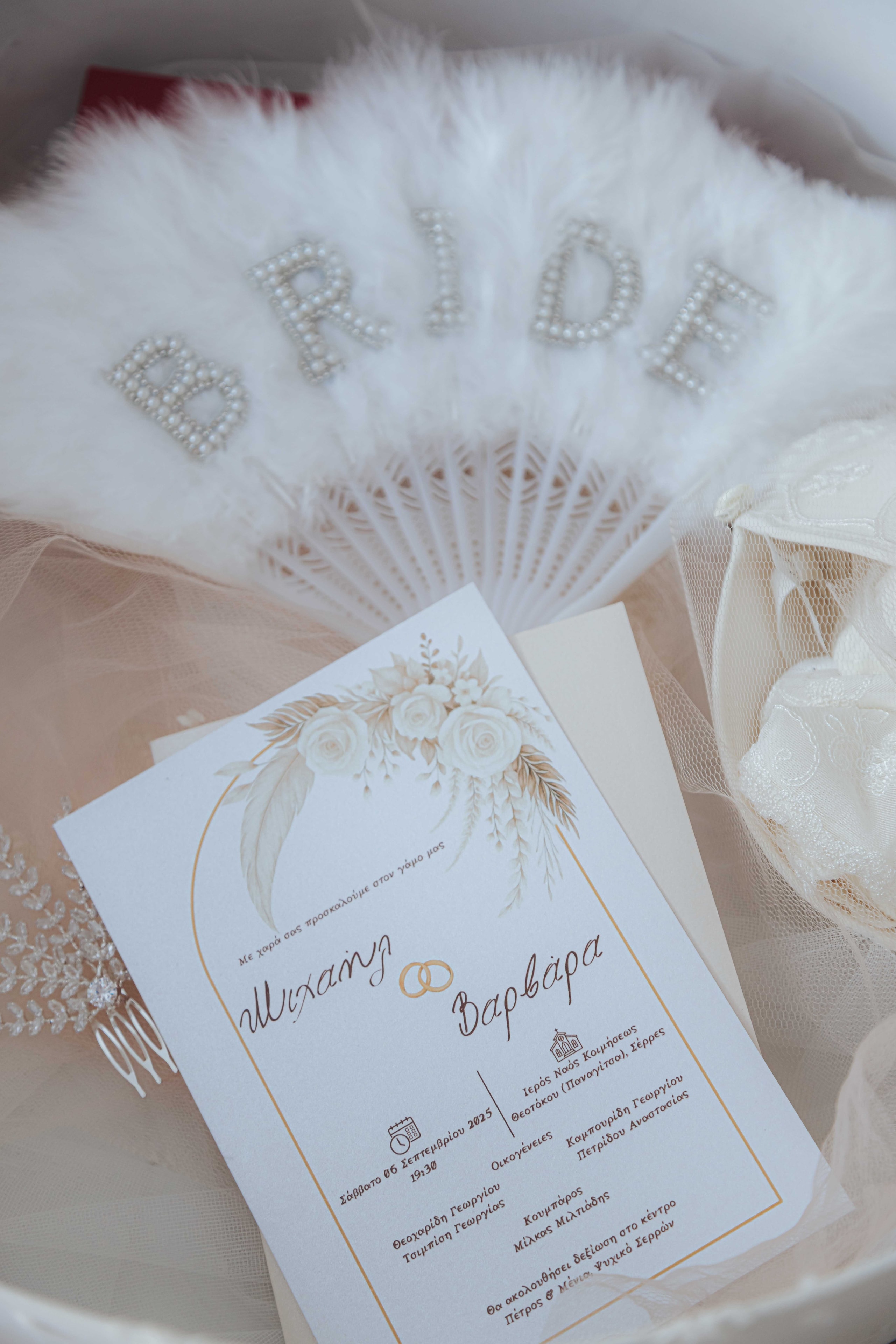 Bridal fan and wedding invitation details