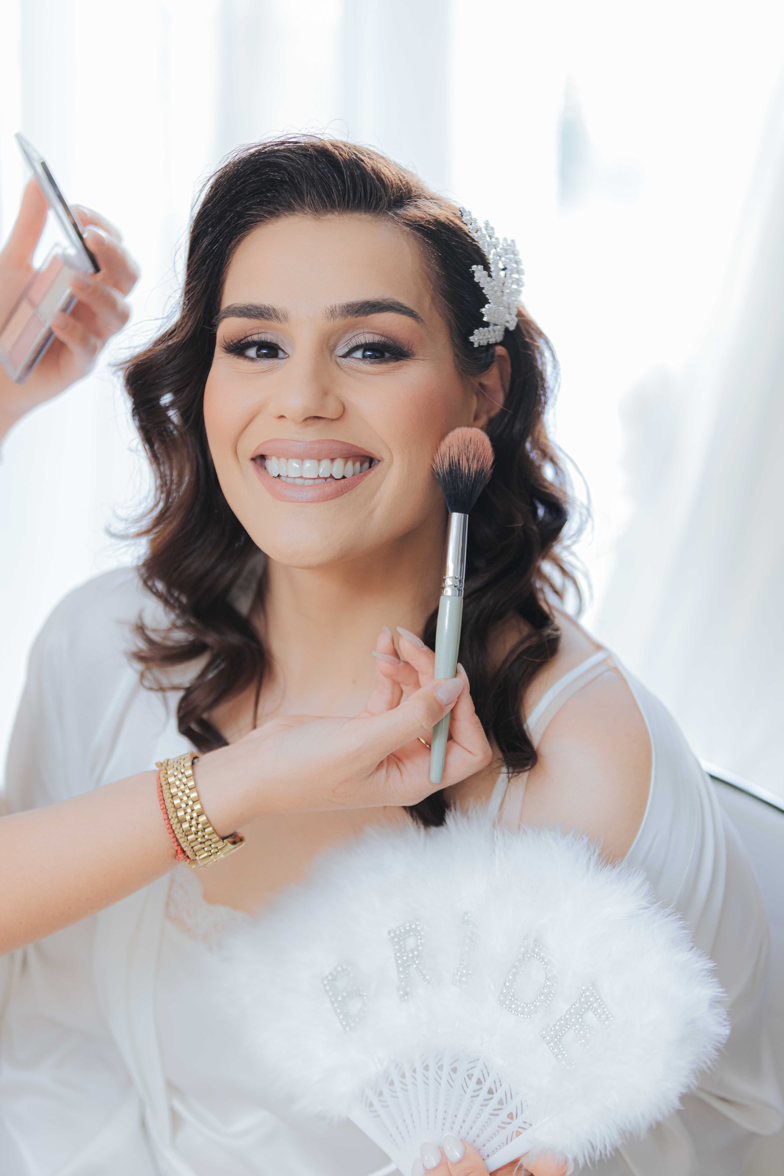 Varvara receiving a makeup touch-up before the ceremony