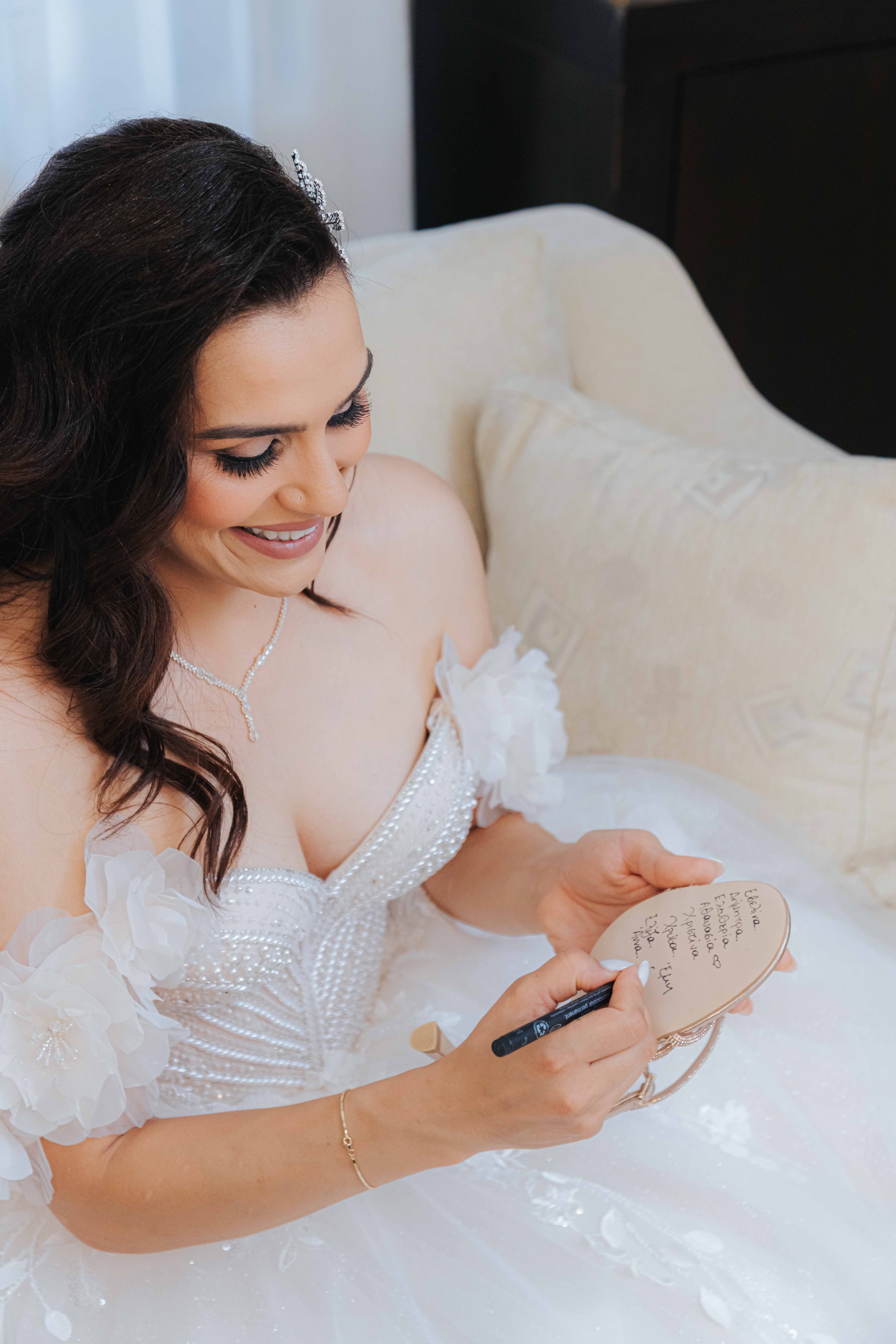 Varvara writing on a wedding keepsake