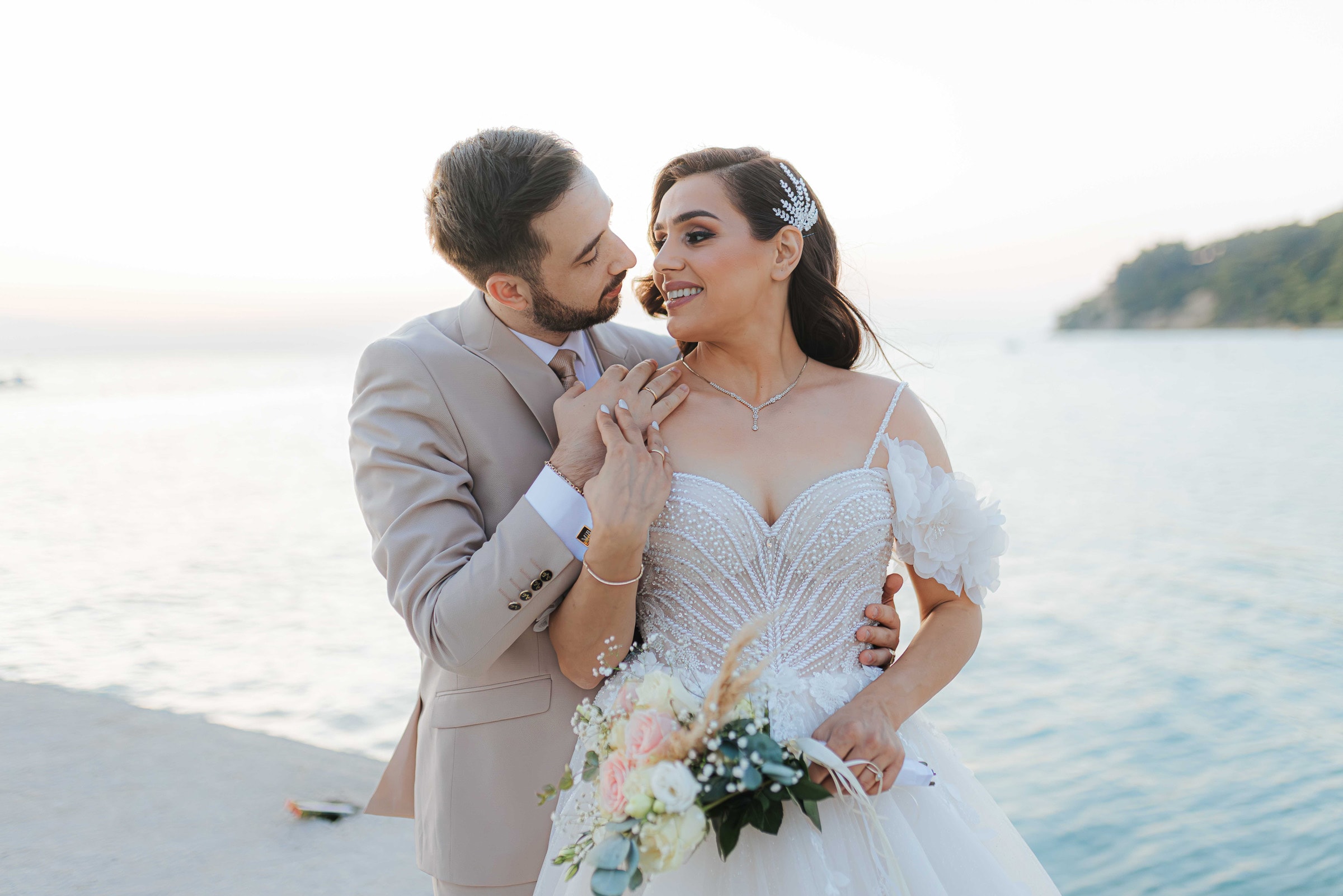 Mihalis and Varvara by the sea on their wedding day
